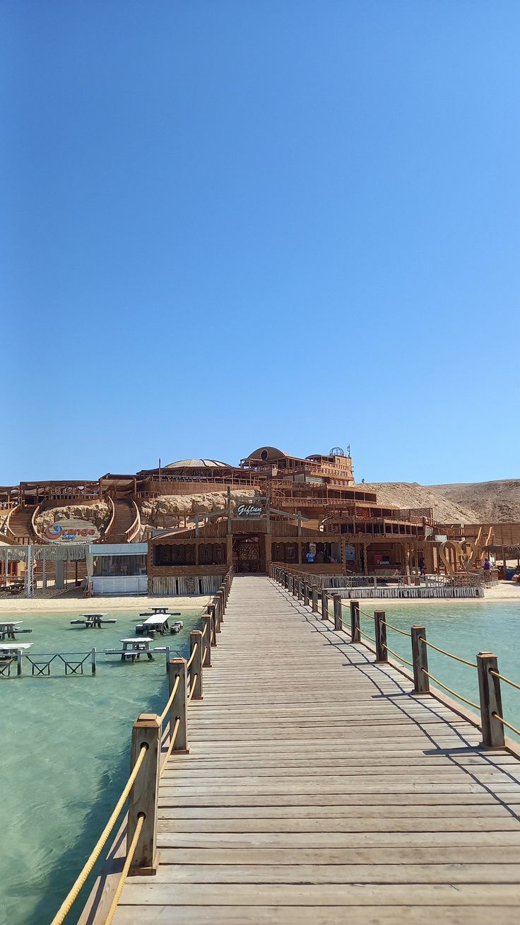 Wooden pier leading to the Orange Bay beach club